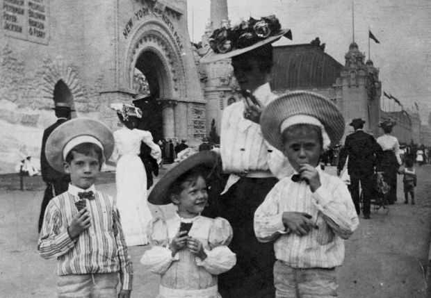 Woman and children eat ice cream at the 1904 World's Fair